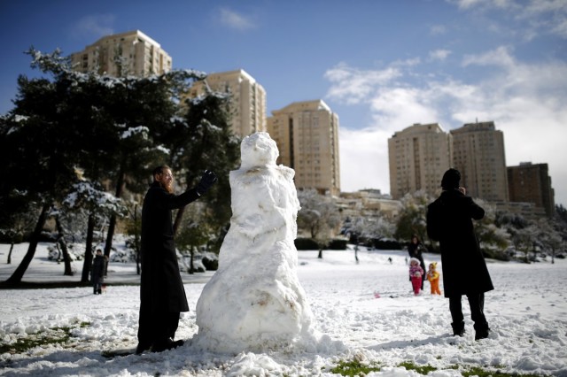 Orthodox Men Build Snowman