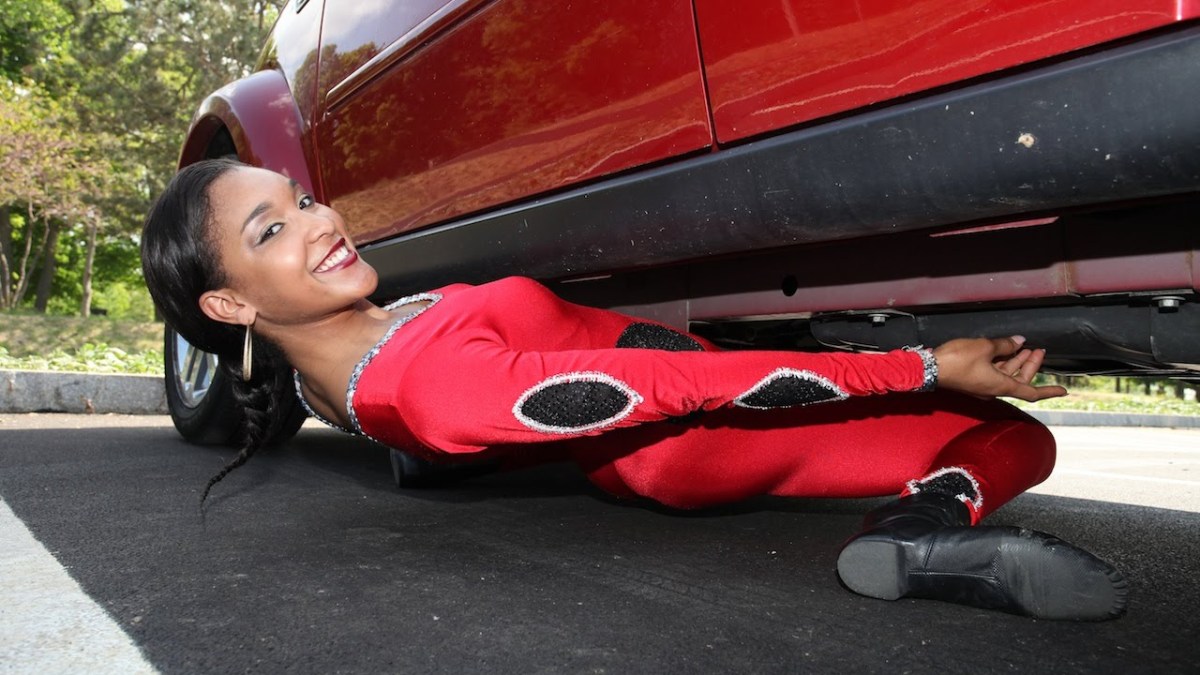 World RecordHolding Limbo Dancer Shimmies Underneath a Car