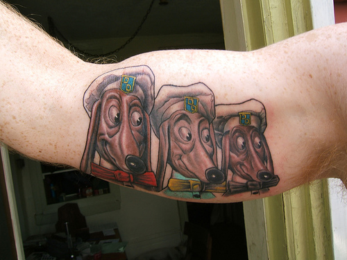  an amazing tattoo inked on his right arm of all three Doggie Diner dog 