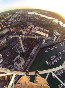 British man climbs construction crane