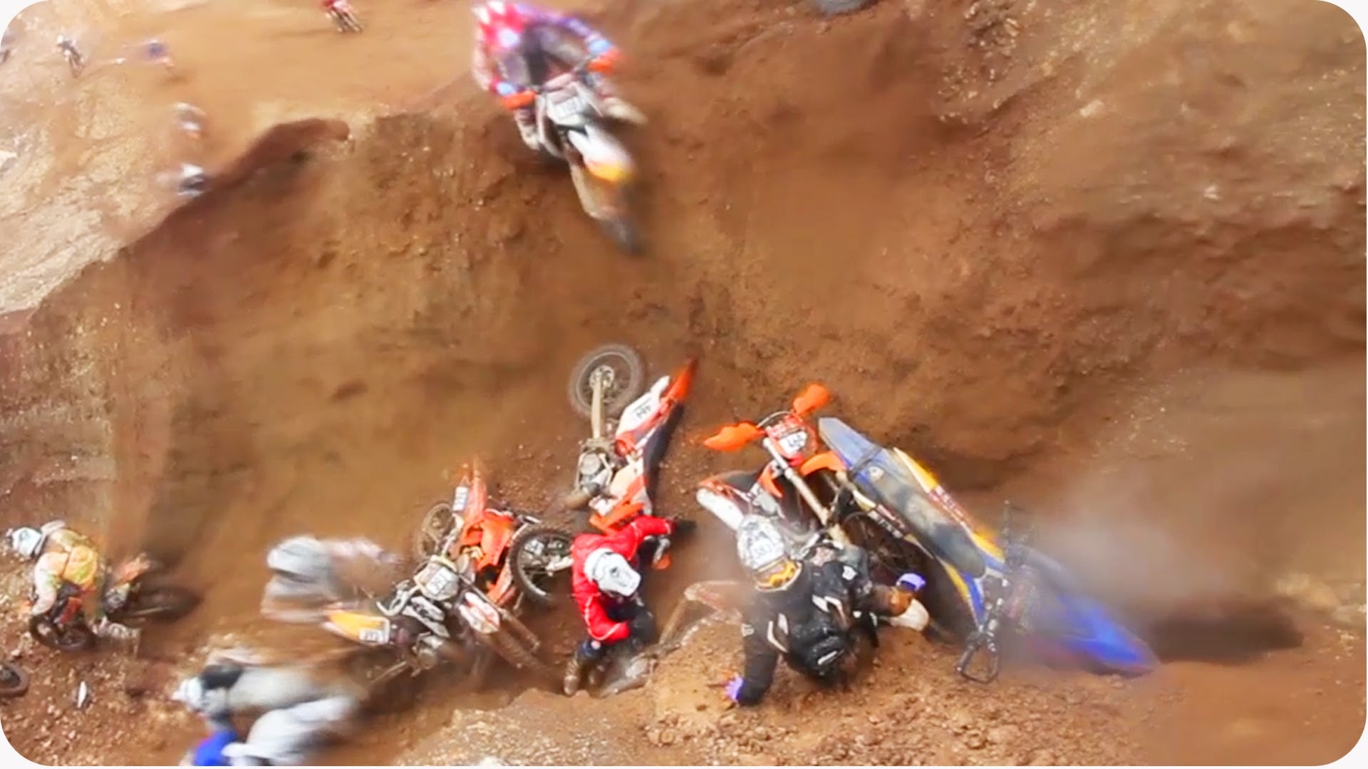 dirt-bikers-fall-off-the-track-in-the-same-spot-and-create-a-huge-pileup