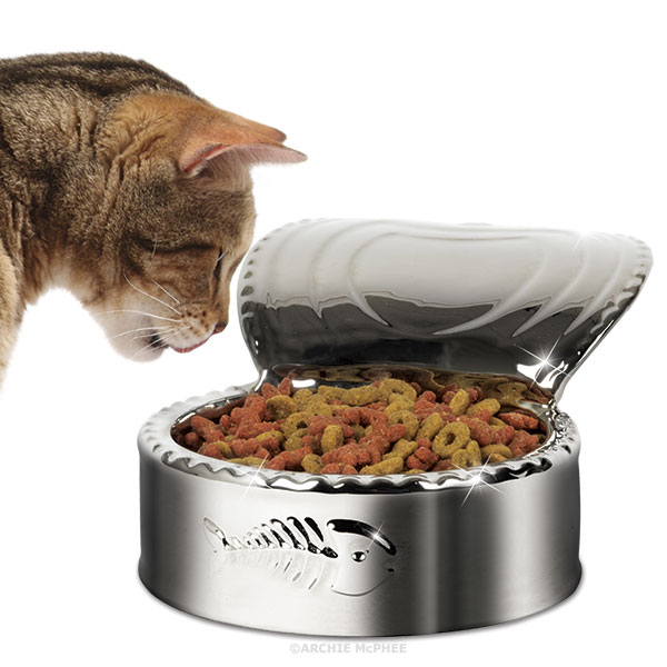 A Silver Plated Cat Dish That Looks Like An Open Can Of Cat Food