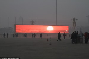 Giant Screens Display Sunrise in Smog Shrouded Beijing