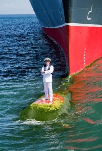 Captain Standing on Bulbous Bow of Queen Mary 2