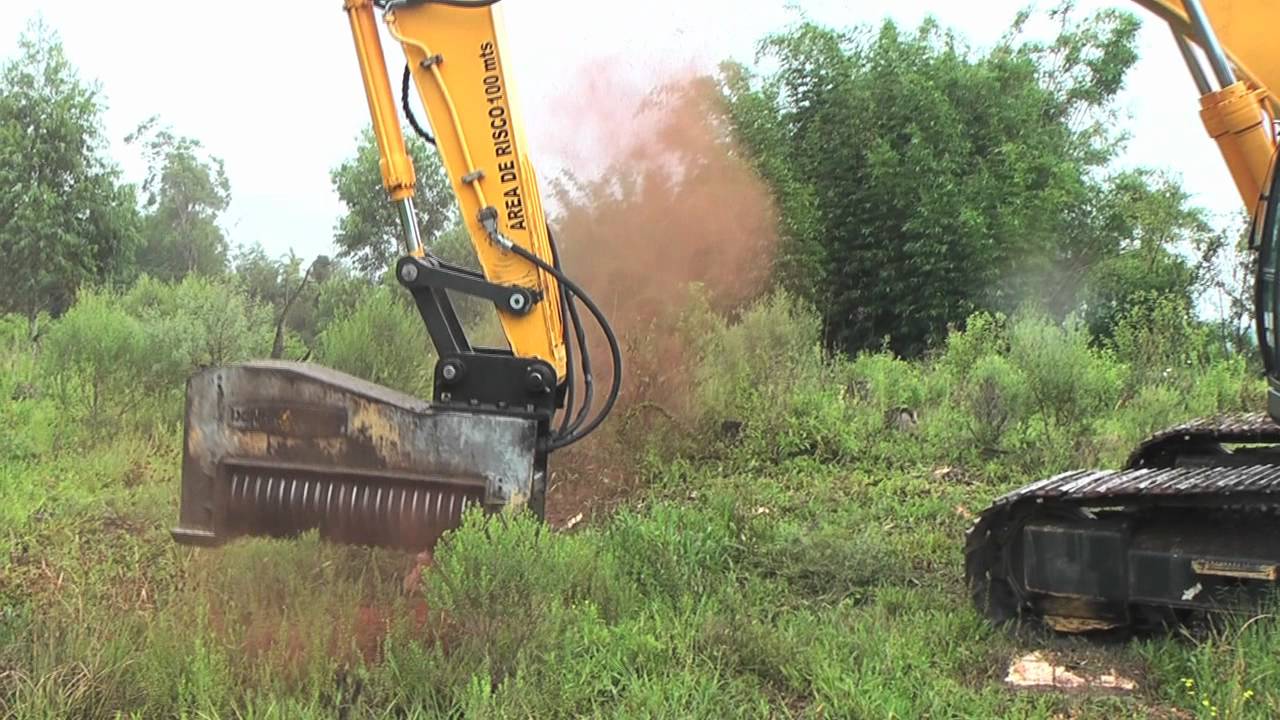 powerful-forestry-mulcher-shreds-through-four-story-tall-pine-trees-and