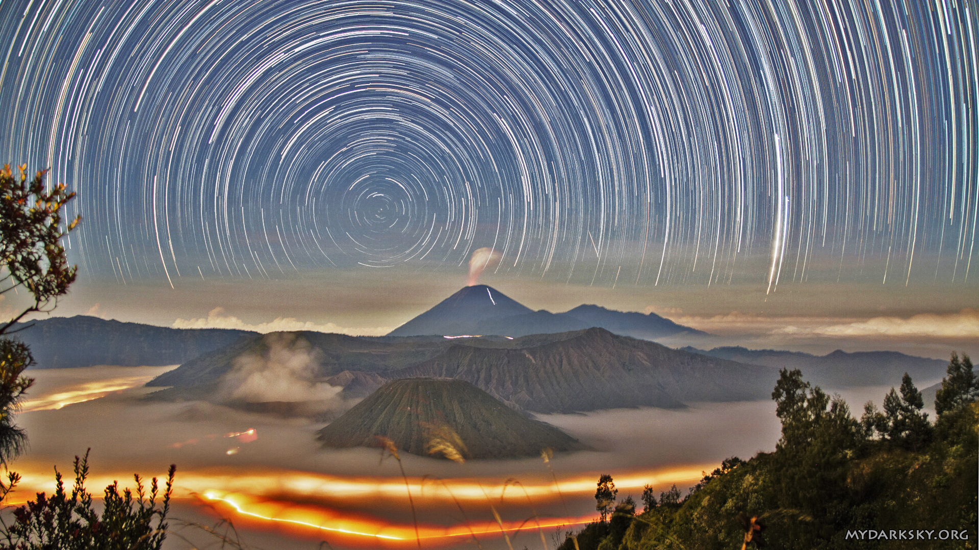 A Stunning Star Trail Photo Featuring Active Volcanoes Mount Semeru and