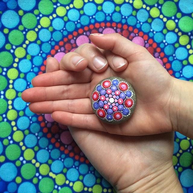 painted stone in hand