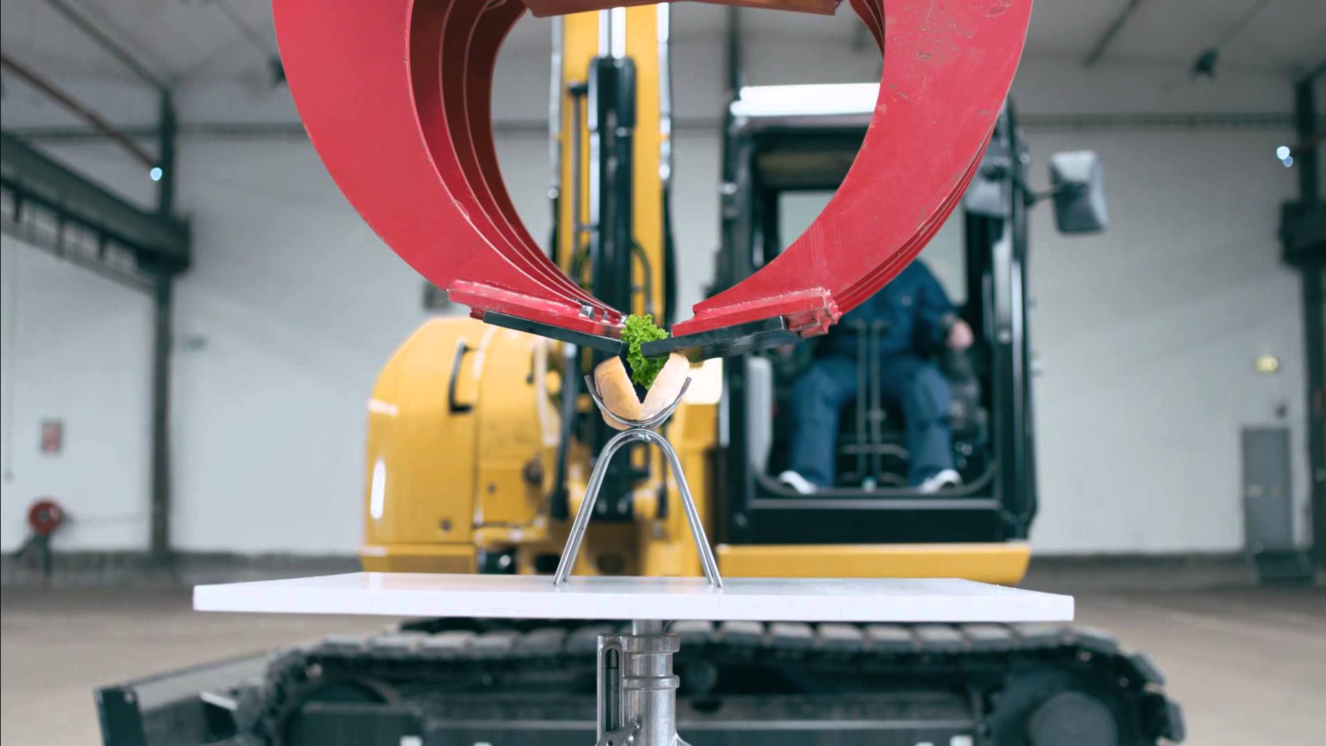 A Man Uses an 8.5Ton Excavator to Prepare a Hot Dog and Feed It to His