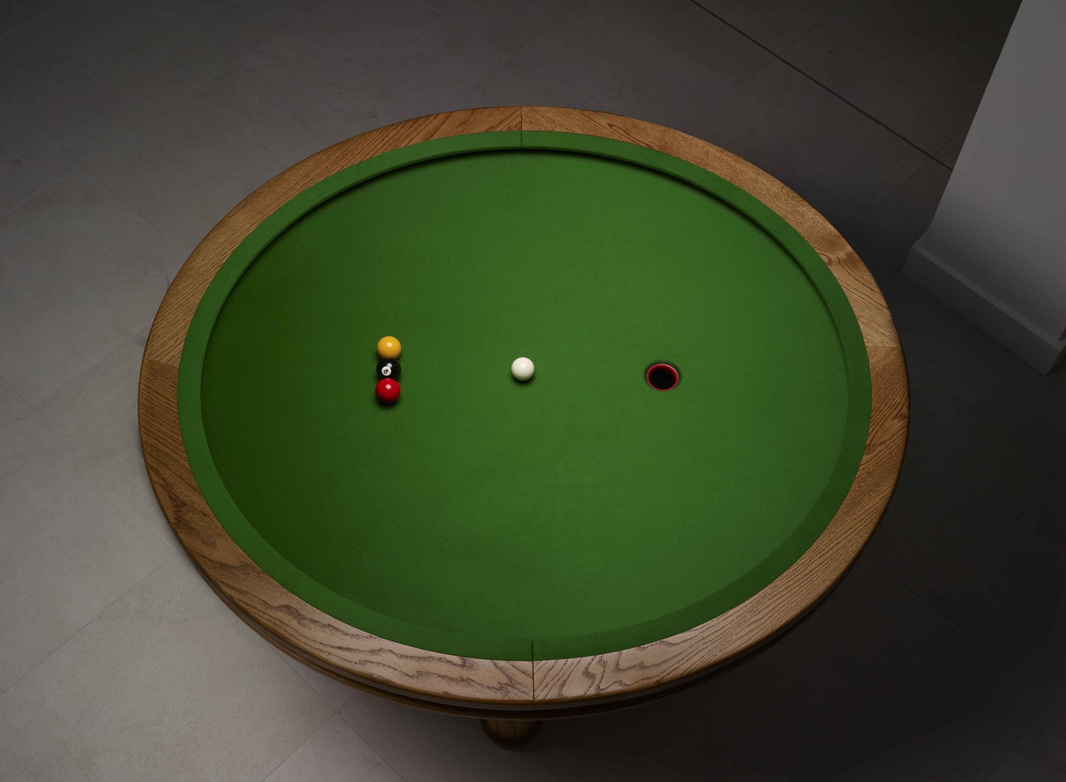 A Unique Elliptical Pool Table and 'Loop' Game Designed by a Mathematician