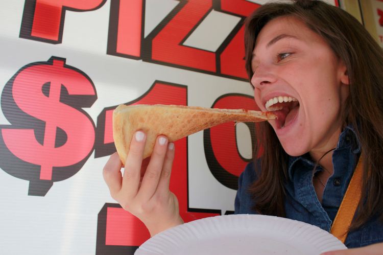 WNYC New Yorker Stock Photo - Woman Enjoys Dollar Slice Pizza