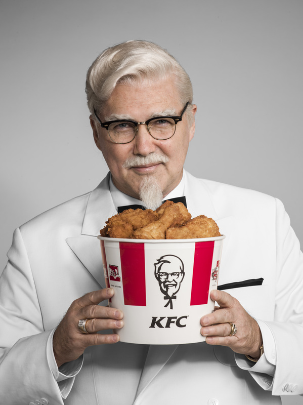 Norm MacDonald Colonel Sanders with a bucket of chicken