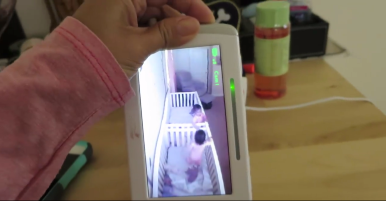 Babies Playing in Crib