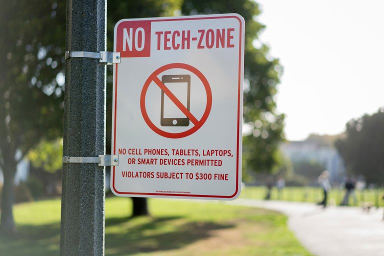 no tech-zone sign on pole