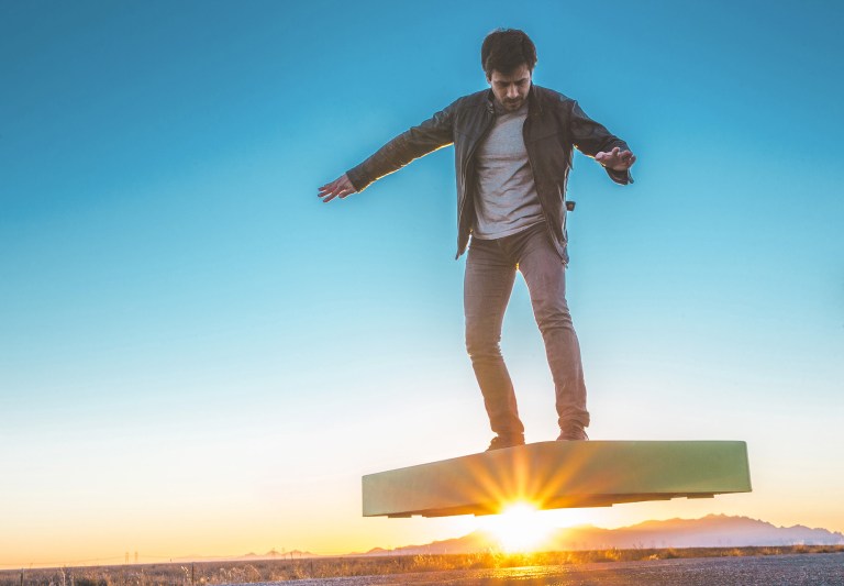 Man Riding ArcaBoard at Sunset