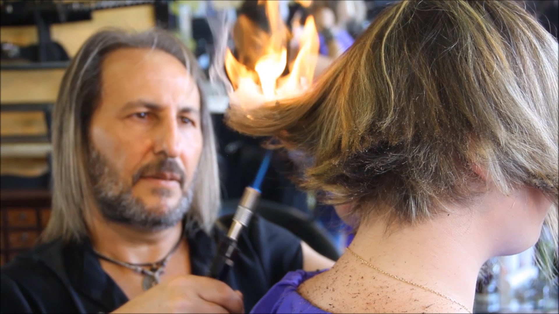 Madrid salon owner Alberto Olmedo masterfully employs flames from a blowtor...