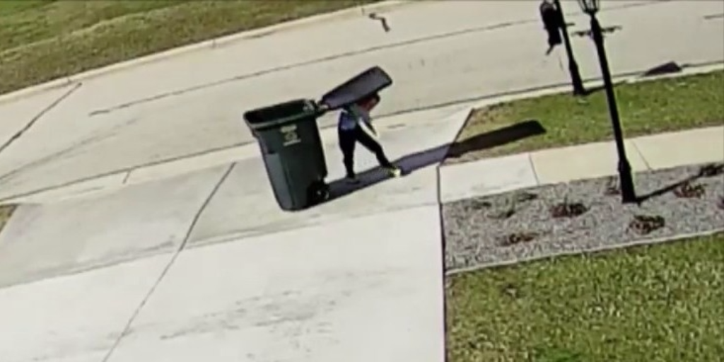 A Kid Tries to Take the Garbage Out on a Windy Day and Gets Beat Down