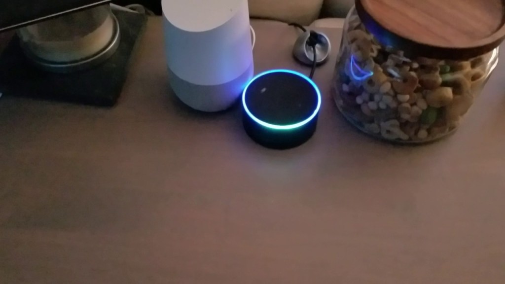 A Pair of Amazon Echo and Google Home Devices Being Tricked Into an