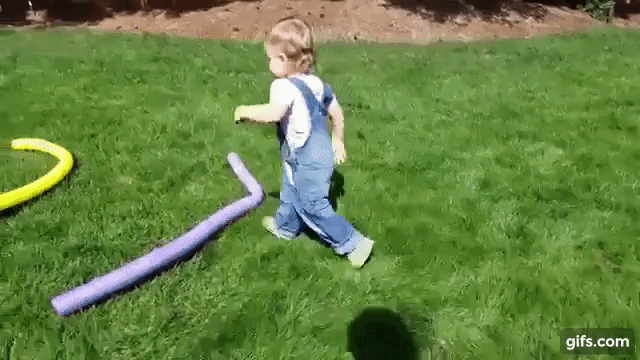 Two year old daughter runs obstacle course