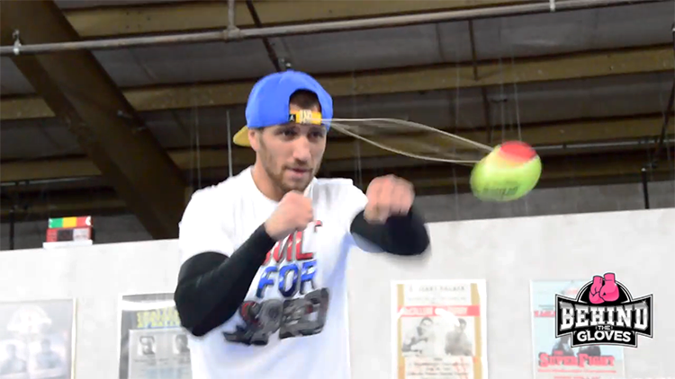 Boxer Shows Off Accuracy by Punching a Tennis Balls That Is Tied to His Hat With Elastic Cord
