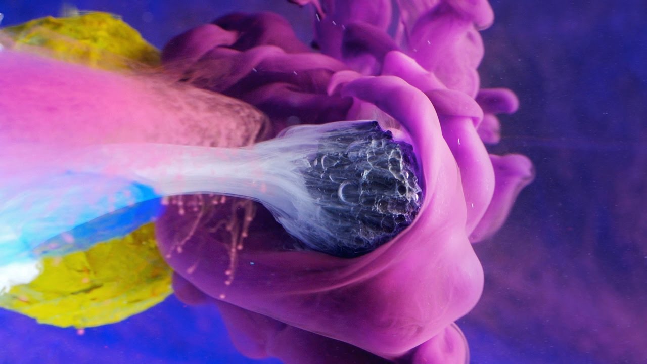 hypnotic-video-of-small-objects-interacting-with-colorful-pillows-of