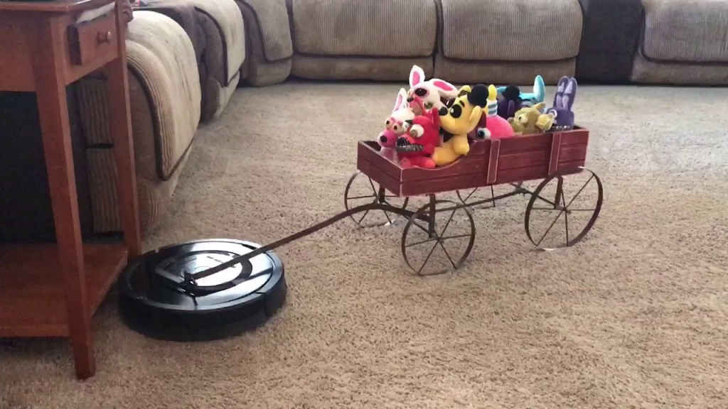 A Thoughtful Roomba Pulls a Wagon Full of Plush Toys For a Short Ride