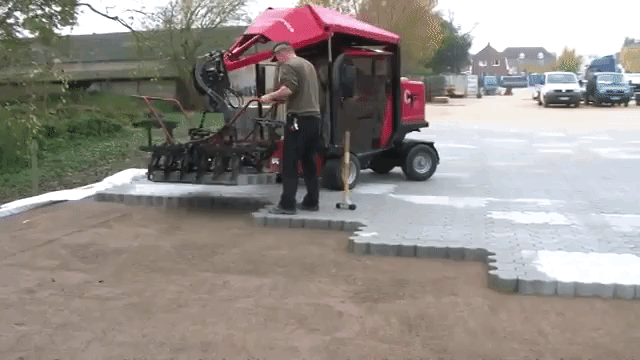 A Paver Laying Machine Pieces Together Large Groups of Interlocking Stones Like a Puzzle