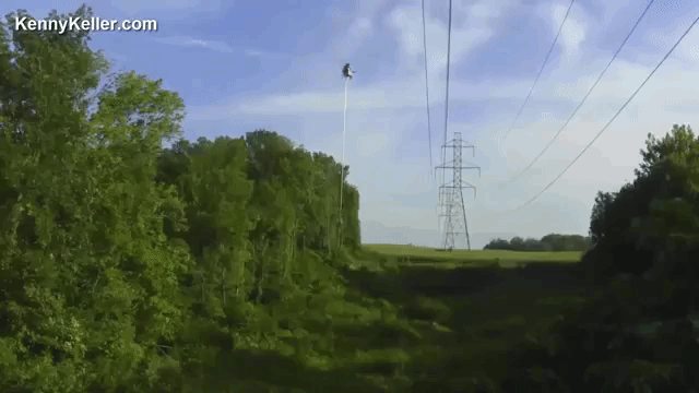 Helicopter Equipped With Giant Aerial Saw Trims Trees Near Power Lines