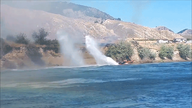 Heroic Couple Uses Spray of Water From Their Jetboat to Help Put Out a Grass Fire