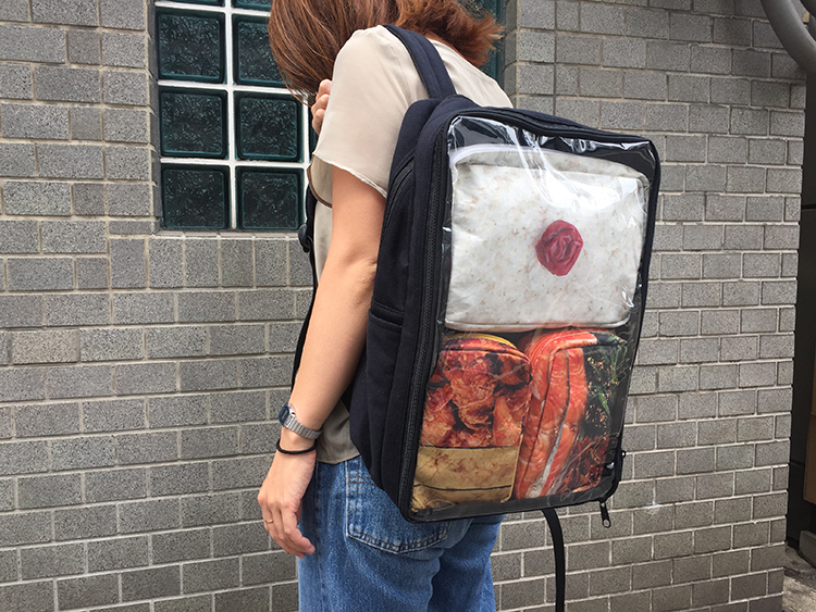 A Bento Backpack That Looks Like It Is Filled With Japanese Food