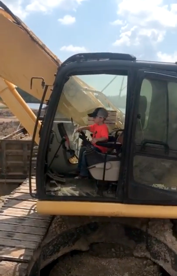 5-year-old-boy-operates-a-giant-backhoe-