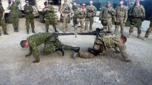 Canadian and American Soldier Face Off In a Friendly One-On-One Game of Tug of War
