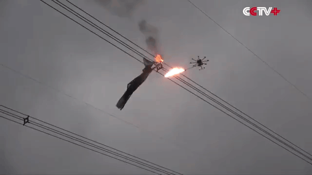 Flame Throwing Drone Removes 40 Feet of Netting Wrapped Around an UHV Power Line in China