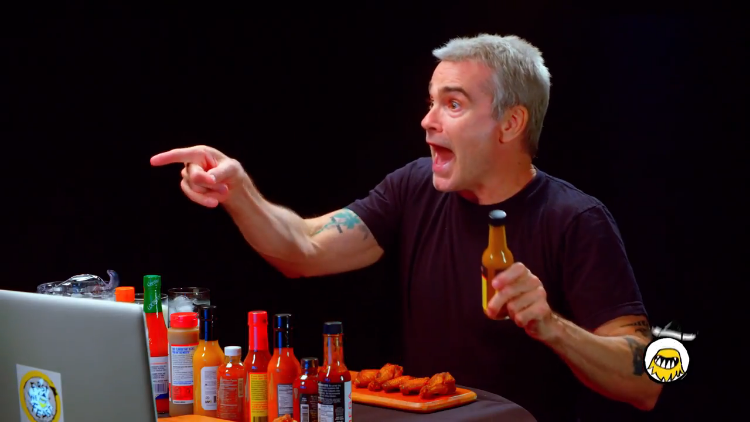 Henry Rollins Tells High-Octane Stories About His Life While Eating Progressively Spicy Wings