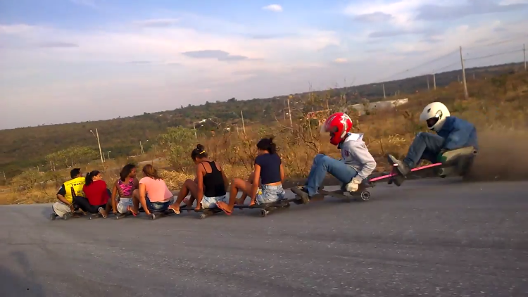 Thrill Seekers in Brazil Engage in an Exciting Downhill Roller-Cart Ride