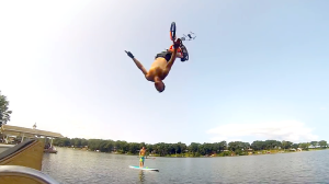 A Man Does a Bicycle Backflip Over Open Water and Smashes Into a Flying Drone