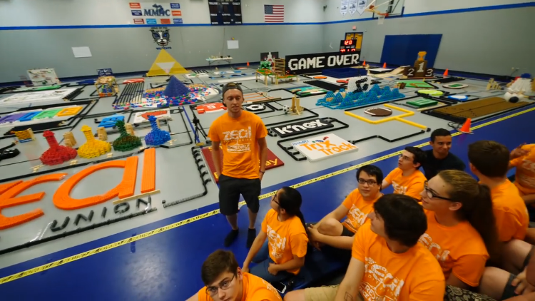 A Team Breaks Three American Records by Toppling Over 250,000 Dominoes