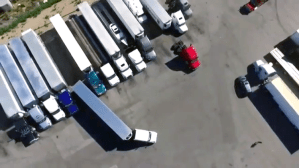 Chill Man Explains How He Backed His Semi-Trailer Truck Into a Tight Spot in Satisfying Aerial Video