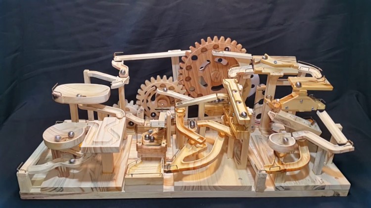 A Wooden Marble Machine Uses Gears and Lifts to Endlessly Push Marbles