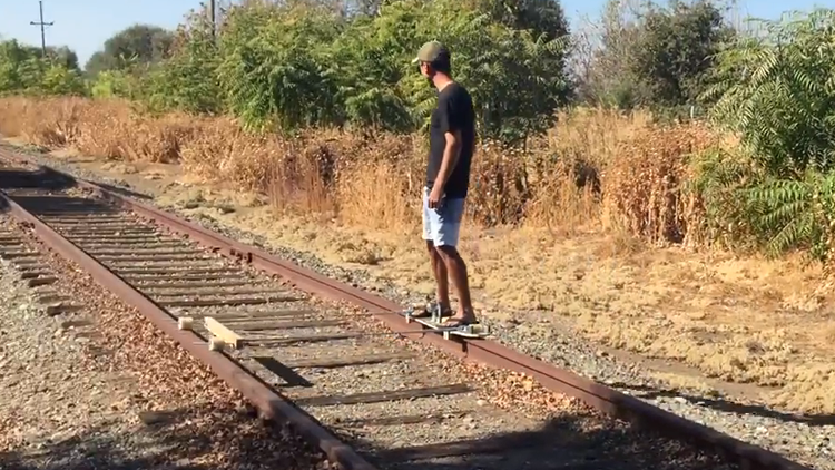 A Man Builds an Electric Skateboard and Rides It on Abandoned Railroad Tracks