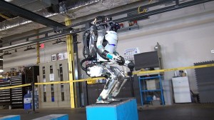 Atlas Humanoid Robot Effortlessly Jumps Onto and Does Back Flips Off of Boxes