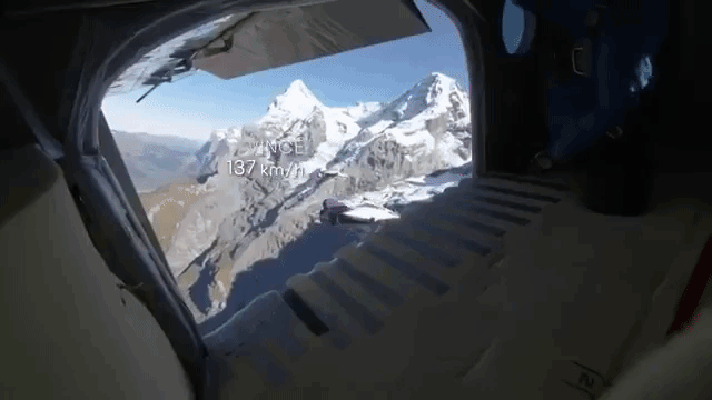 Fearless Wingsuit Pilots Jump From the Top of a Mountain and Safely Fly Into a Passing Plane