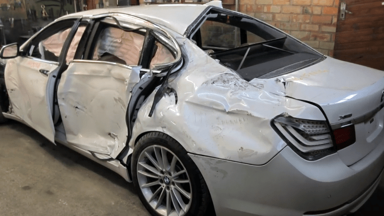 Russian Auto Body Mechanic Brings a Totaled BMW 7 Series Car Back to Life