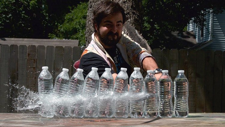 Slow Motion Video of a Katana Slicing Through Plastic Water Bottles