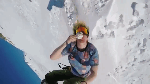 Snowboarder Films Himself Drinking Coffee While Doing a Back Flip