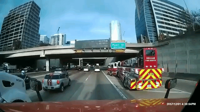 A Dallas Fire Truck Smoothly Drifts Across Four Lanes of Rush Hour Traffic