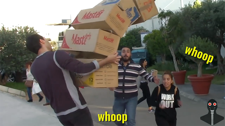 Men Frighten Strangers by Pretending to Drop a Tall Stack of Boxes on Top of Them