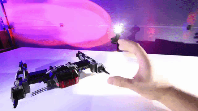 Stop Motion Animation of a Man Building a LEGO Star Wars TIE Fighter With Force Powers