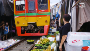 Train Runs Through Thailand Market