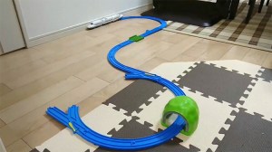 A Toy Train Derails and Then Uses a Wall to Hop Back Onto the Tracks Again