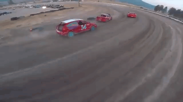 POV Footage of a High-Speed Drone Chasing After Stock Race Cars